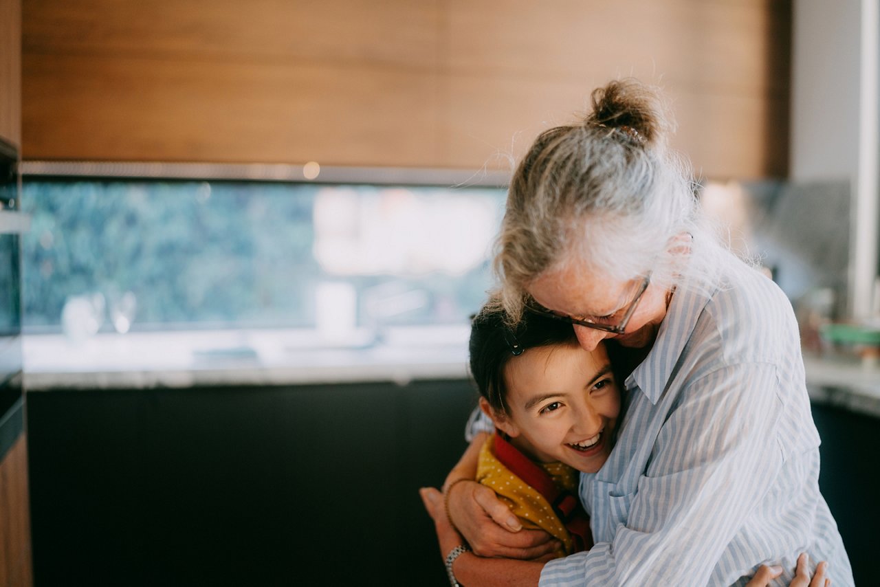 Grandmother cuddling child