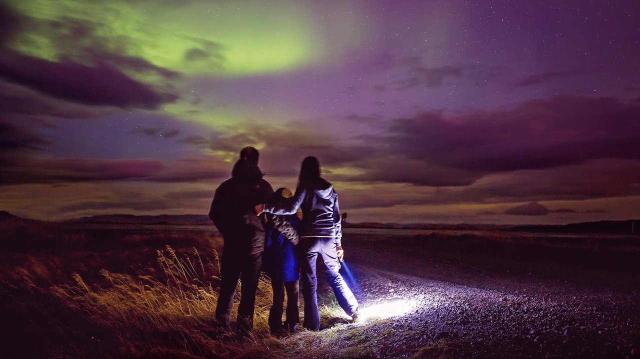 Family looking at the Northern Lights